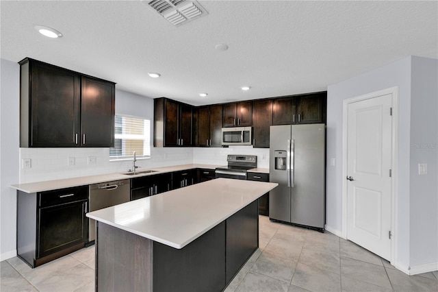 4492 Bluff Oak Loop, Kissimmee, FL 34746 - kitchen with appliances with stainless steel finishes, a sink, decorative backsplash, baseboards, and recessed lighting