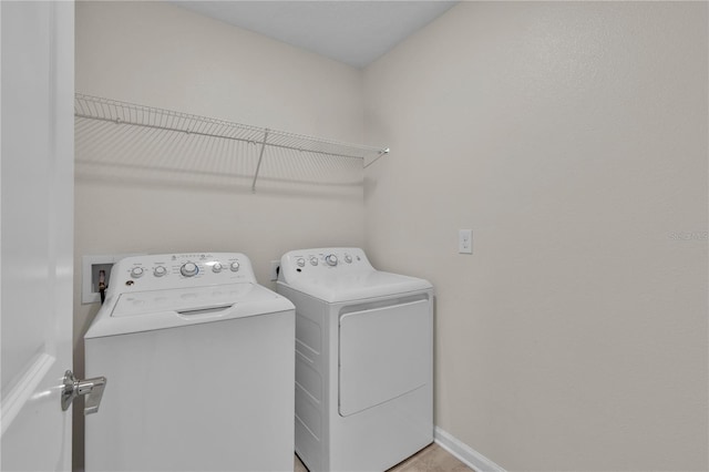 4492 Bluff Oak Loop, Kissimmee, FL 34746 - washroom with separate washer and dryer and baseboards