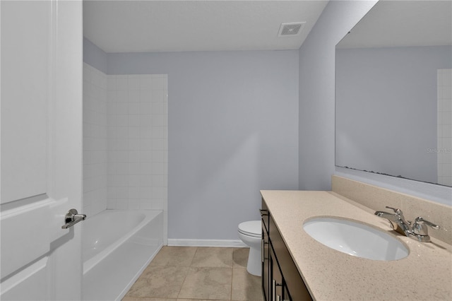 4492 Bluff Oak Loop, Kissimmee, FL 34746 - bathroom featuring toilet, vanity, tile patterned flooring, and baseboards