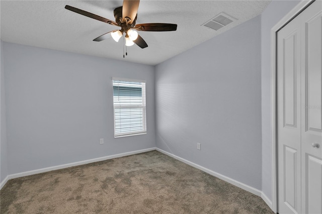 4492 Bluff Oak Loop, Kissimmee, FL 34746 - empty room featuring a ceiling fan, carpet floors, baseboards, and a textured ceiling