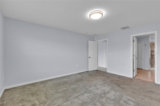 4492 Bluff Oak Loop, Kissimmee, FL 34746 - unfurnished bedroom featuring carpet floors, a textured ceiling, and baseboards