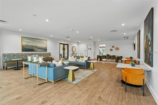 4492 Bluff Oak Loop, Kissimmee, FL 34746 - living area featuring light wood finished floors and recessed lighting