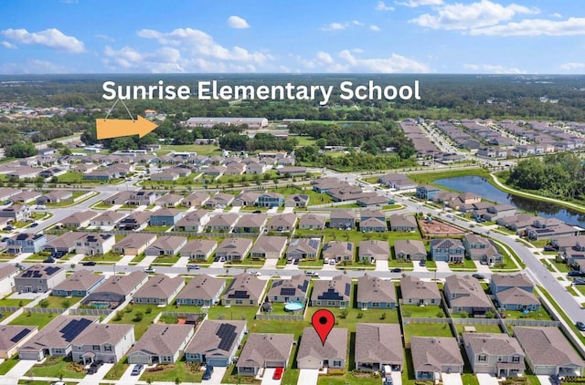 4492 Bluff Oak Loop, Kissimmee, FL 34746 - aerial view of property and surrounding area featuring a nearby body of water and nearby suburban area