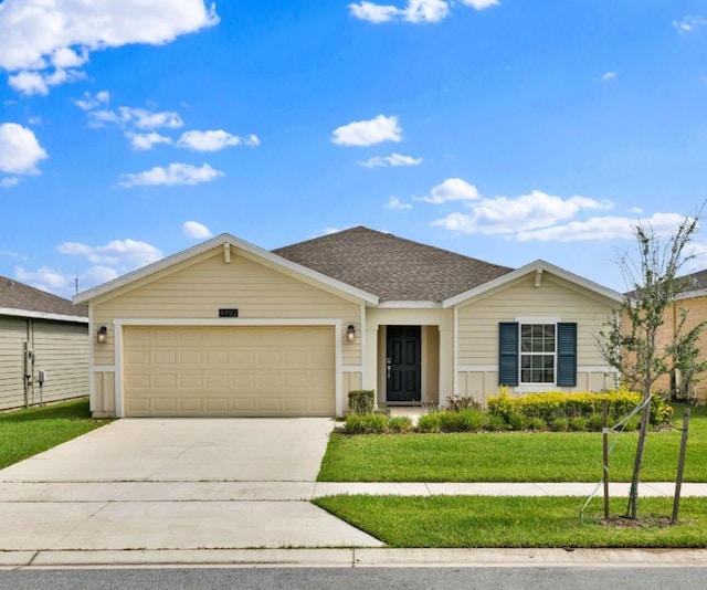 4492 Bluff Oak Loop, Kissimmee, FL 34746 - ranch-style home with driveway, an attached garage, and a front yard