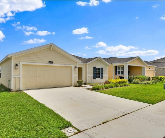 4492 Bluff Oak Loop, Kissimmee, FL 34746 - ranch-style house with an attached garage, driveway, and a front yard