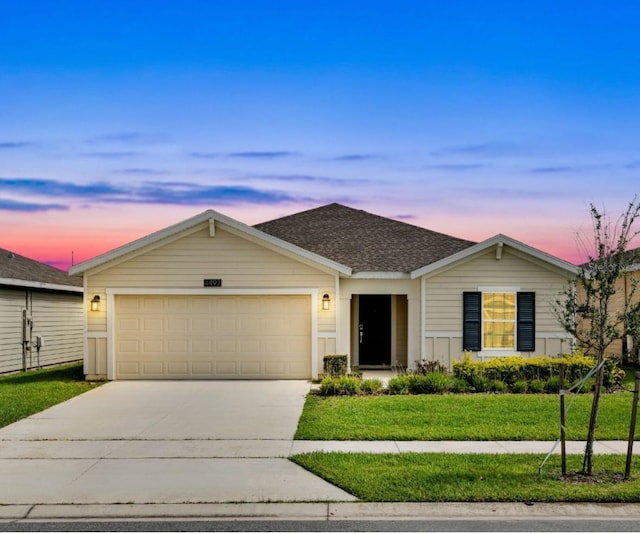 4492 Bluff Oak Loop, Kissimmee, FL 34746 - single story home featuring driveway, a garage, a front lawn, and roof with shingles