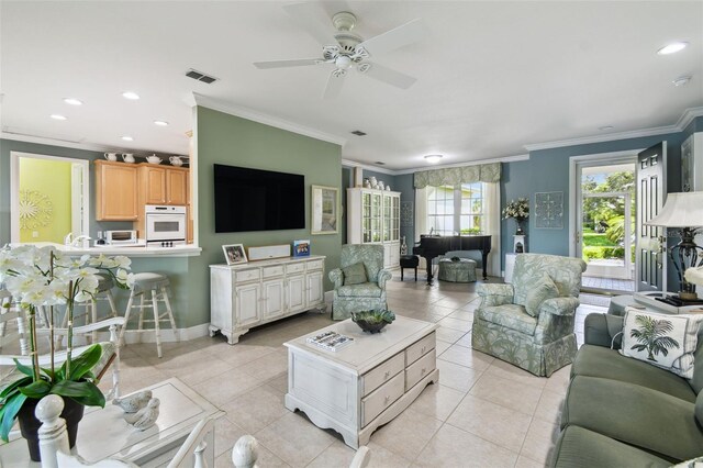 201 Largo Dr, Kissimmee, FL 34759 - living area with ornamental molding, a ceiling fan, light tile patterned floors, and recessed lighting