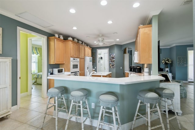 201 Largo Dr, Kissimmee, FL 34759 - kitchen with white appliances, ornamental molding, recessed lighting, light tile patterned flooring, and ceiling fan