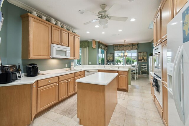 201 Largo Dr, Kissimmee, FL 34759 - kitchen with white appliances, a peninsula, ornamental molding, ceiling fan, and recessed lighting