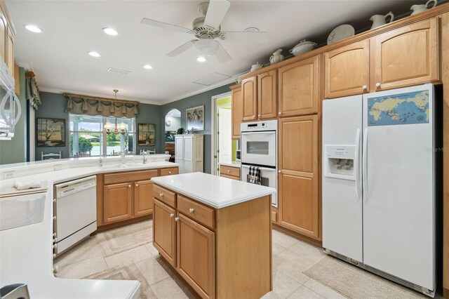 201 Largo Dr, Kissimmee, FL 34759 - kitchen with white appliances, crown molding, light tile patterned flooring, light countertops, and recessed lighting