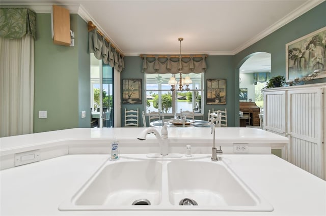201 Largo Dr, Kissimmee, FL 34759 - detailed view of crown molding, arched walkways, and a chandelier