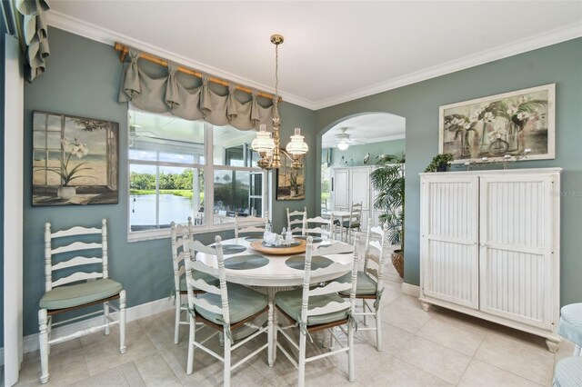 201 Largo Dr, Kissimmee, FL 34759 - dining space featuring crown molding, a ceiling fan, a water view, arched walkways, and tile patterned flooring