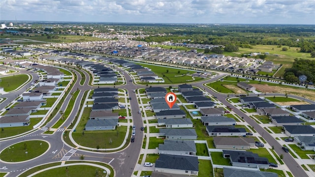 1719 Daystar Dr, Haines City, FL 33844 - aerial view of property and surrounding area featuring nearby suburban area