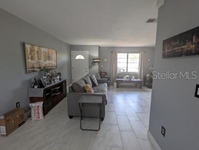 946 Delano Ct, Kissimmee, FL 34758 - living room with light marble finish floors