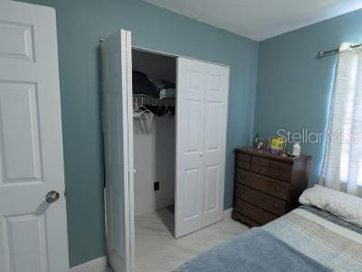 946 Delano Ct, Kissimmee, FL 34758 - bedroom with a closet and baseboards