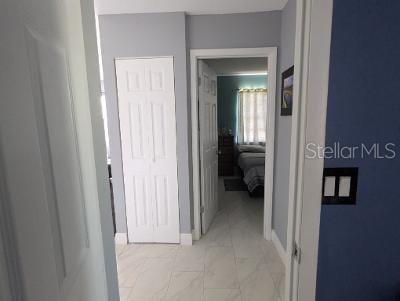 946 Delano Ct, Kissimmee, FL 34758 - hall with light marble finish flooring and baseboards