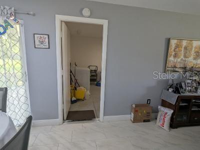 946 Delano Ct, Kissimmee, FL 34758 - bathroom with a bath, marble finish flooring, and baseboards