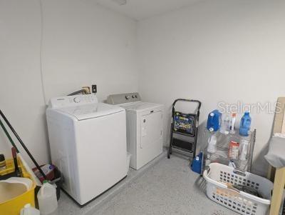946 Delano Ct, Kissimmee, FL 34758 - laundry area with washing machine and dryer