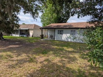 946 Delano Ct, Kissimmee, FL 34758 - back of house with a lawn