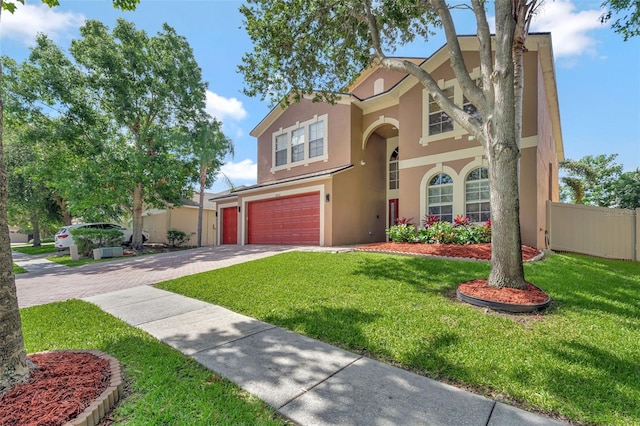 6932 Gray Catbird Loop, Wesley Chapel, FL 33545 - traditional home featuring stucco siding, driveway, and an attached garage