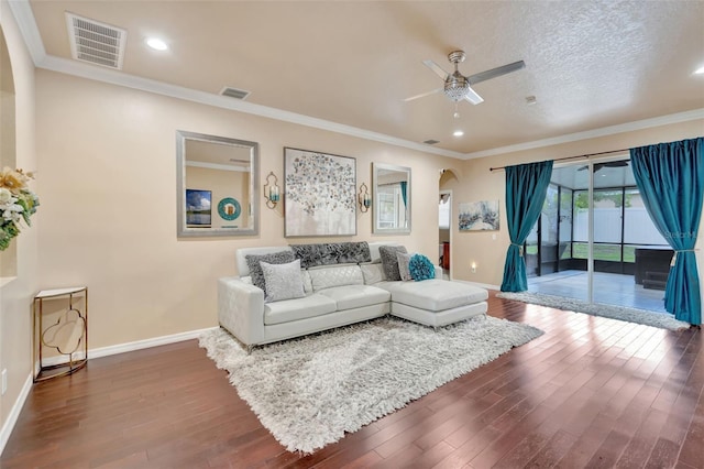 6932 Gray Catbird Loop, Wesley Chapel, FL 33545 - living room with arched walkways, ceiling fan, wood-type flooring, recessed lighting, and ornamental molding