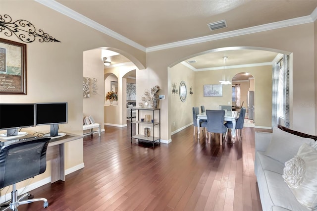 6932 Gray Catbird Loop, Wesley Chapel, FL 33545 - office area with dark wood-type flooring, arched walkways, and ornamental molding
