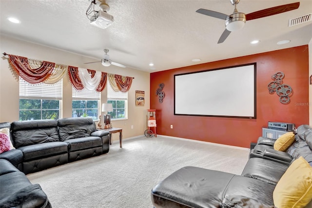 6932 Gray Catbird Loop, Wesley Chapel, FL 33545 - carpeted home theater room featuring ceiling fan, recessed lighting, and a textured ceiling