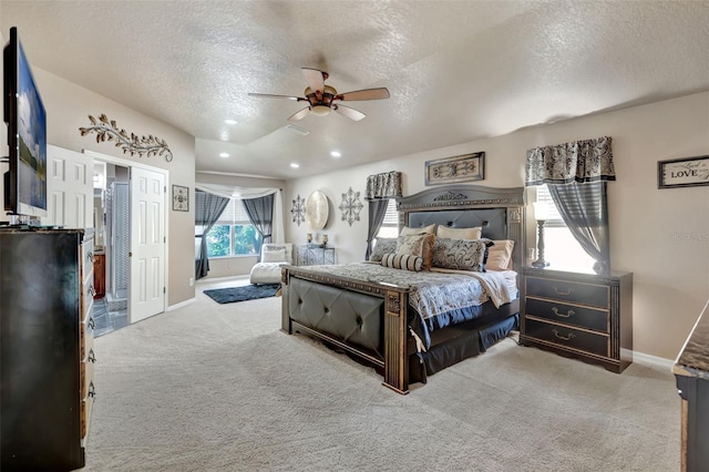 6932 Gray Catbird Loop, Wesley Chapel, FL 33545 - carpeted bedroom featuring a textured ceiling, ceiling fan, and recessed lighting