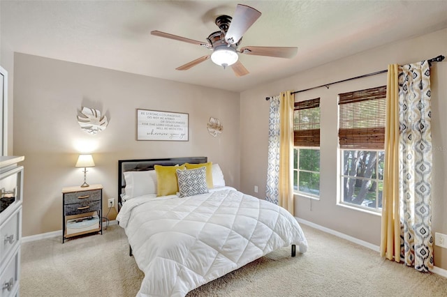 6932 Gray Catbird Loop, Wesley Chapel, FL 33545 - carpeted bedroom featuring multiple windows and a ceiling fan
