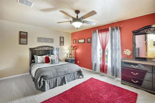 6932 Gray Catbird Loop, Wesley Chapel, FL 33545 - carpeted bedroom featuring a ceiling fan and a textured ceiling