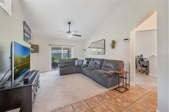 1631 Woodbay Ct, Kissimmee, FL 34744 - living room with light carpet, ceiling fan, and vaulted ceiling