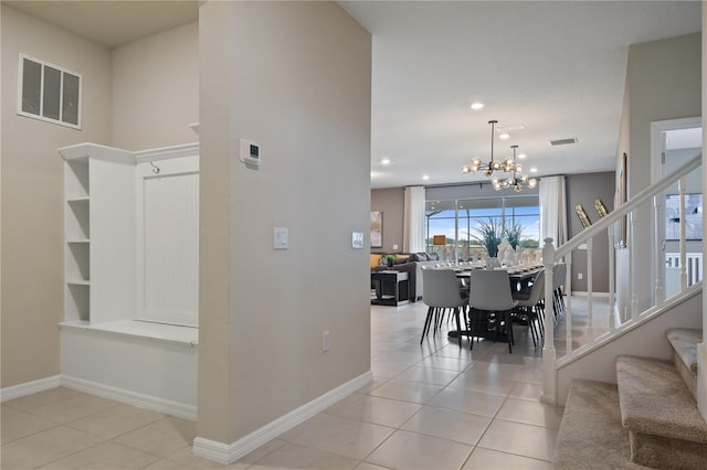 2176 Lelani Cir, Davenport, FL 33897 - stairway featuring tile patterned flooring, a chandelier, baseboards, and recessed lighting