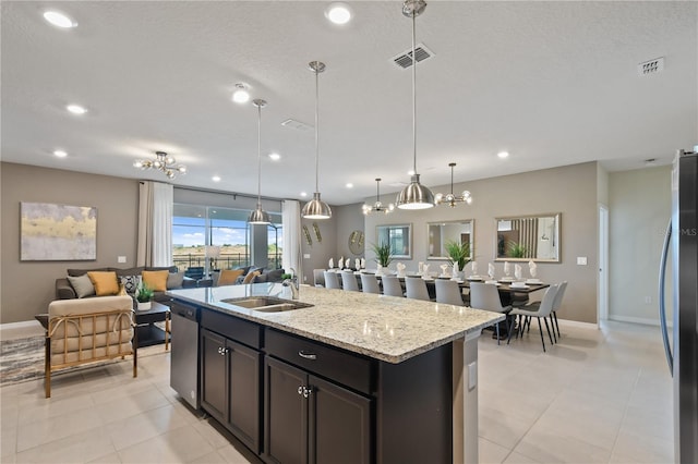 2176 Lelani Cir, Davenport, FL 33897 - kitchen featuring a sink, appliances with stainless steel finishes, open floor plan, baseboards, and recessed lighting