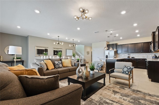 2176 Lelani Cir, Davenport, FL 33897 - living room featuring a chandelier, recessed lighting, and stairs