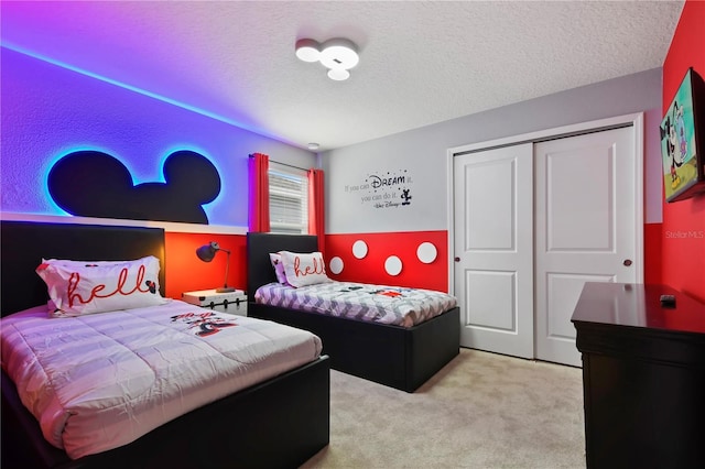 2176 Lelani Cir, Davenport, FL 33897 - bedroom featuring a closet, a textured ceiling, and carpet flooring