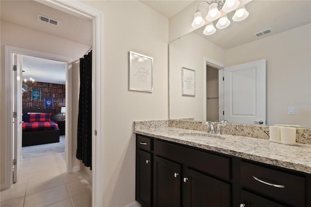 2176 Lelani Cir, Davenport, FL 33897 - full bath featuring vanity, a chandelier, tile patterned flooring, and baseboards