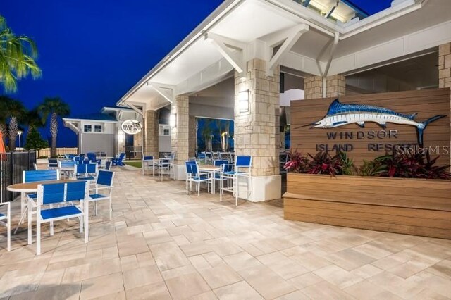 2176 Lelani Cir, Davenport, FL 33897 - patio at night featuring outdoor dining area and a patio