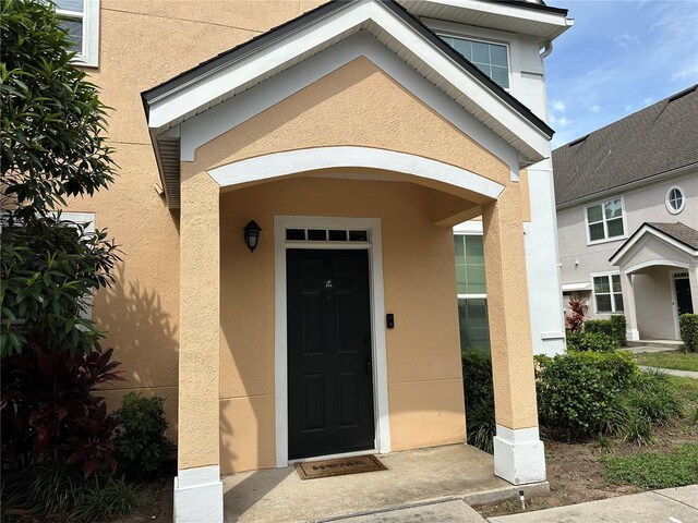 3301 Soho St Unit 104, Orlando, FL 32835 - property entrance with stucco siding