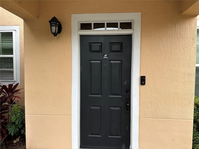 3301 Soho St Unit 104, Orlando, FL 32835 - entrance to property with stucco siding