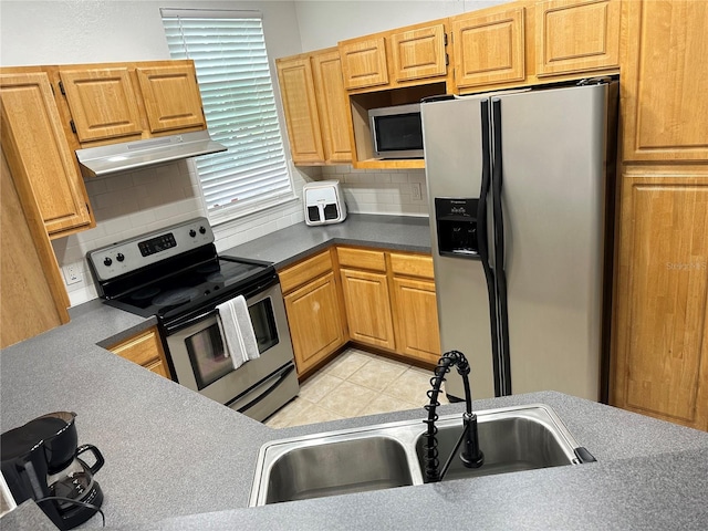 3301 Soho St Unit 104, Orlando, FL 32835 - kitchen with stainless steel appliances, ventilation hood, a sink, and decorative backsplash
