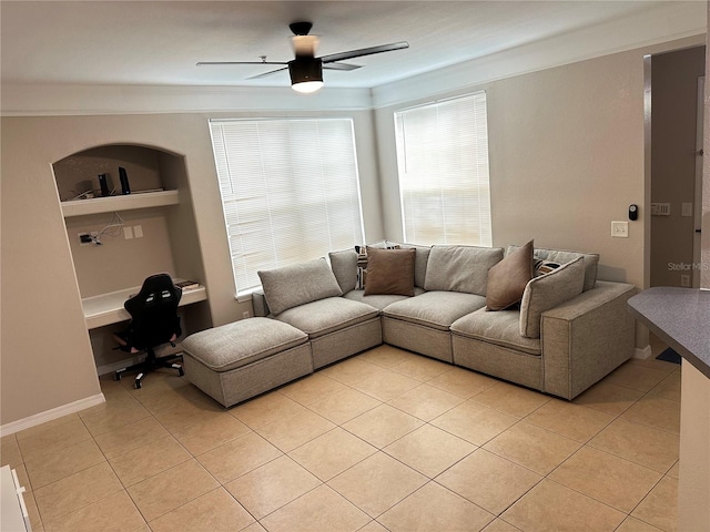 3301 Soho St Unit 104, Orlando, FL 32835 - living room with a ceiling fan, light tile patterned floors, and ornamental molding