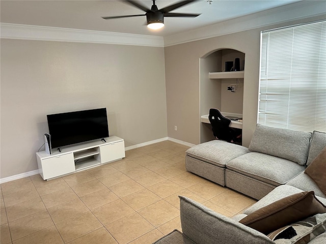 3301 Soho St Unit 104, Orlando, FL 32835 - living area with crown molding, a ceiling fan, light tile patterned floors, baseboards, and arched walkways