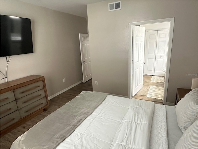 3301 Soho St Unit 104, Orlando, FL 32835 - bedroom featuring wood finished floors and baseboards