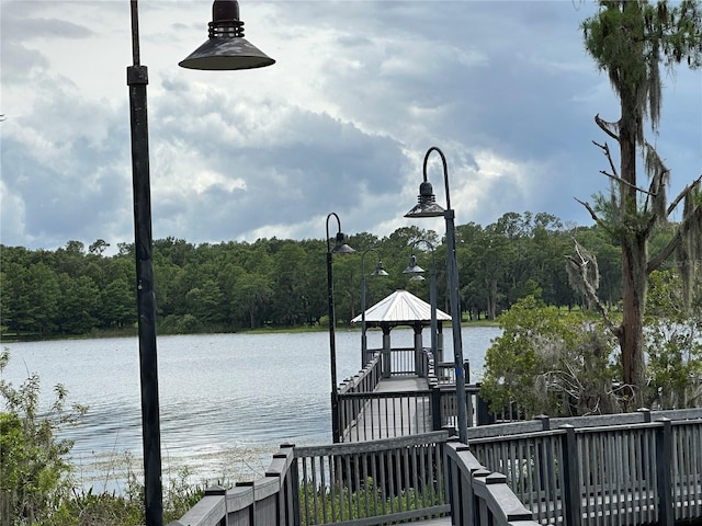 3301 Soho St Unit 104, Orlando, FL 32835 - dock with a gazebo, a water view, and a forest view