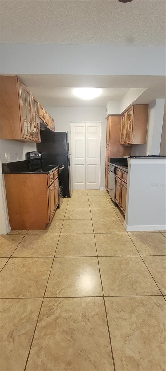 1023 S Hiawassee Rd Unit 4017, Orlando, FL 32835 - kitchen with brown cabinets, dark countertops, dishwasher, glass insert cabinets, and a textured ceiling