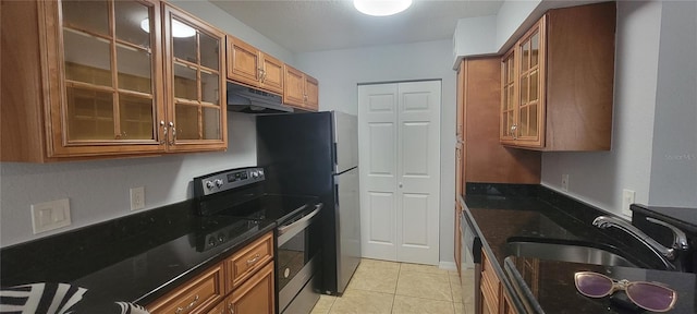 1023 S Hiawassee Rd Unit 4017, Orlando, FL 32835 - kitchen with appliances with stainless steel finishes, under cabinet range hood, brown cabinets, and dark stone countertops