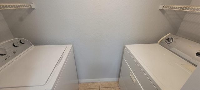 1023 S Hiawassee Rd Unit 4017, Orlando, FL 32835 - laundry room featuring washer and dryer and light tile patterned floors