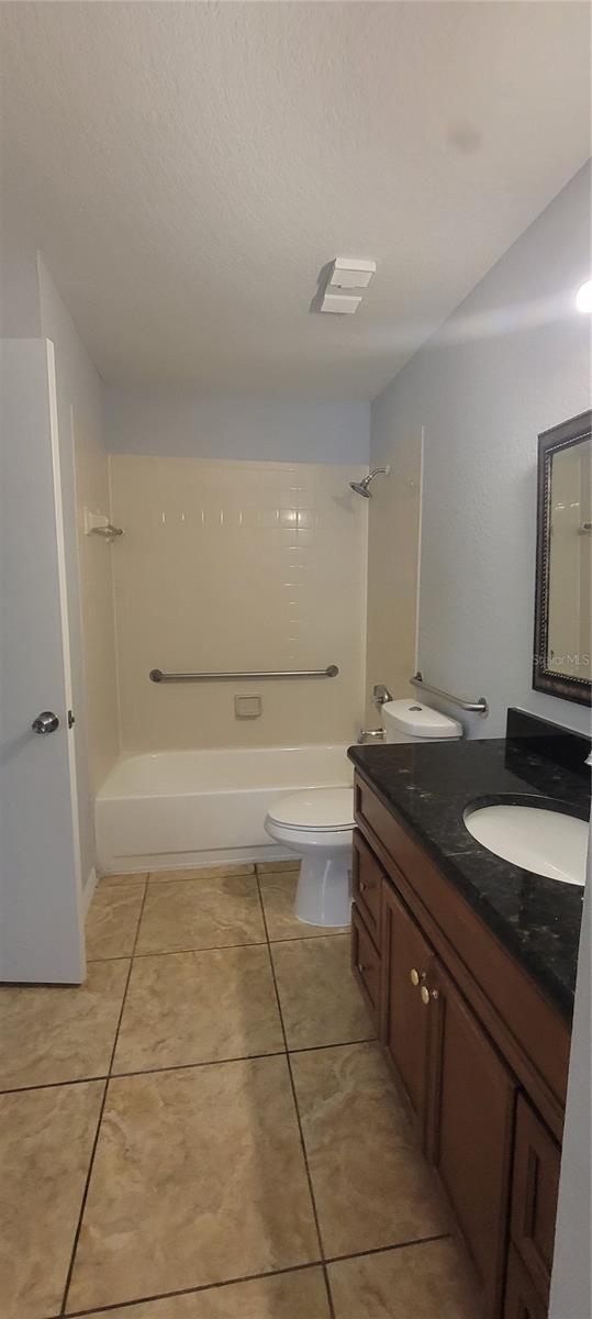 1023 S Hiawassee Rd Unit 4017, Orlando, FL 32835 - full bathroom with double vanity, tub / shower combination, and tile patterned flooring