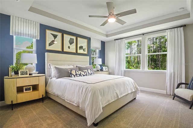 222 Thornberry Way, Palm Coast, FL 32164 - carpeted bedroom featuring a raised ceiling, ornamental molding, and a ceiling fan