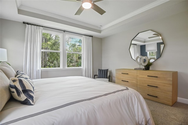 222 Thornberry Way, Palm Coast, FL 32164 - bedroom featuring a raised ceiling, ornamental molding, light carpet, and a ceiling fan